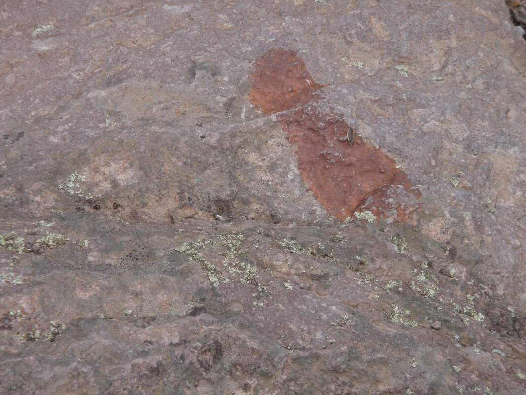 A painted shoe mark on bedrock